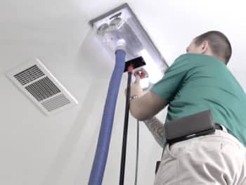 Air duct cleaning technician